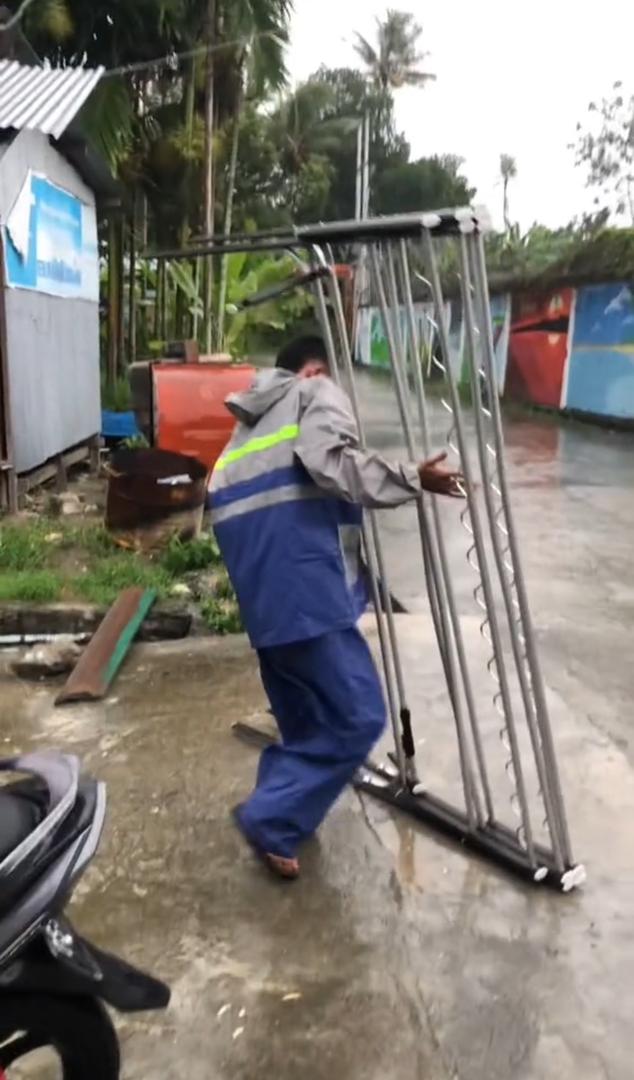 Man carrying a clothe hanger