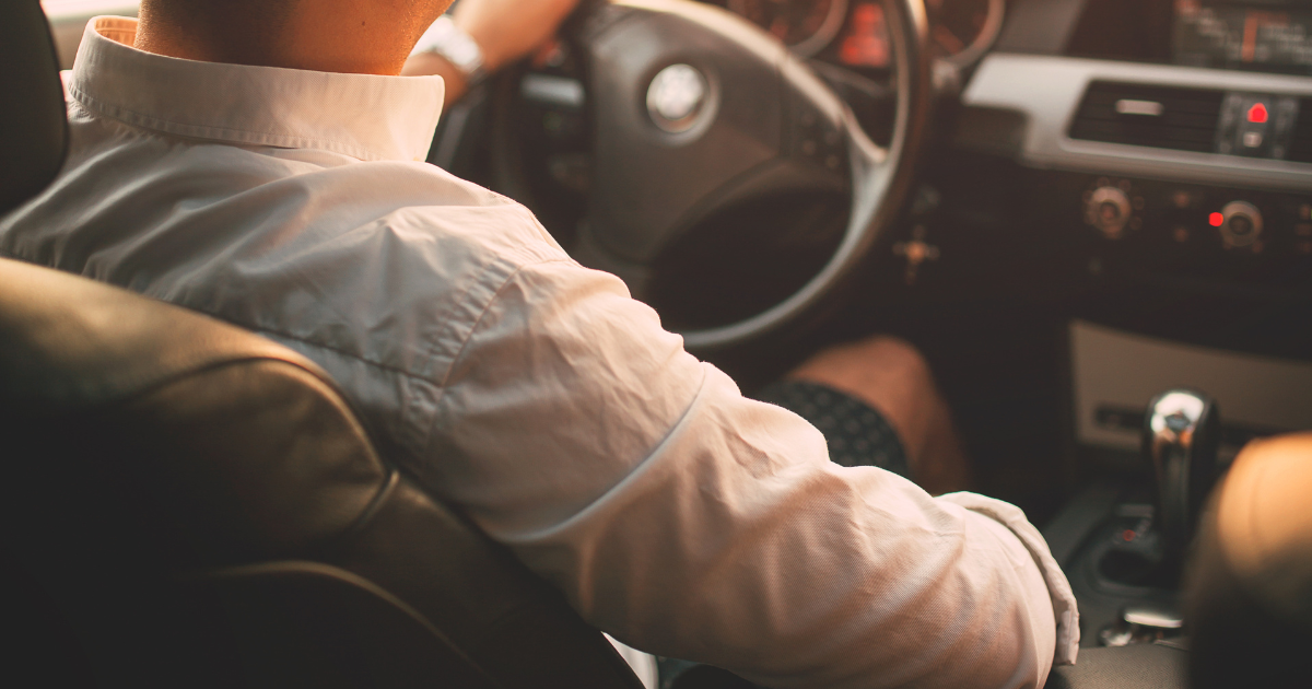 man driving a car