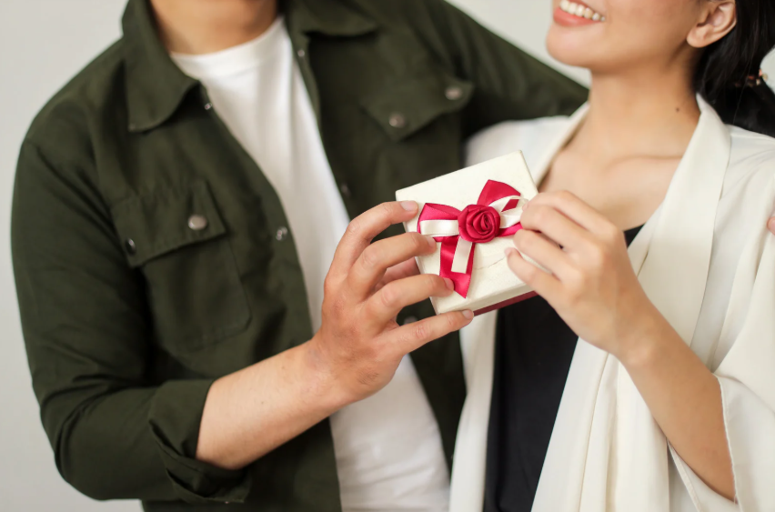 man giving partner a gift