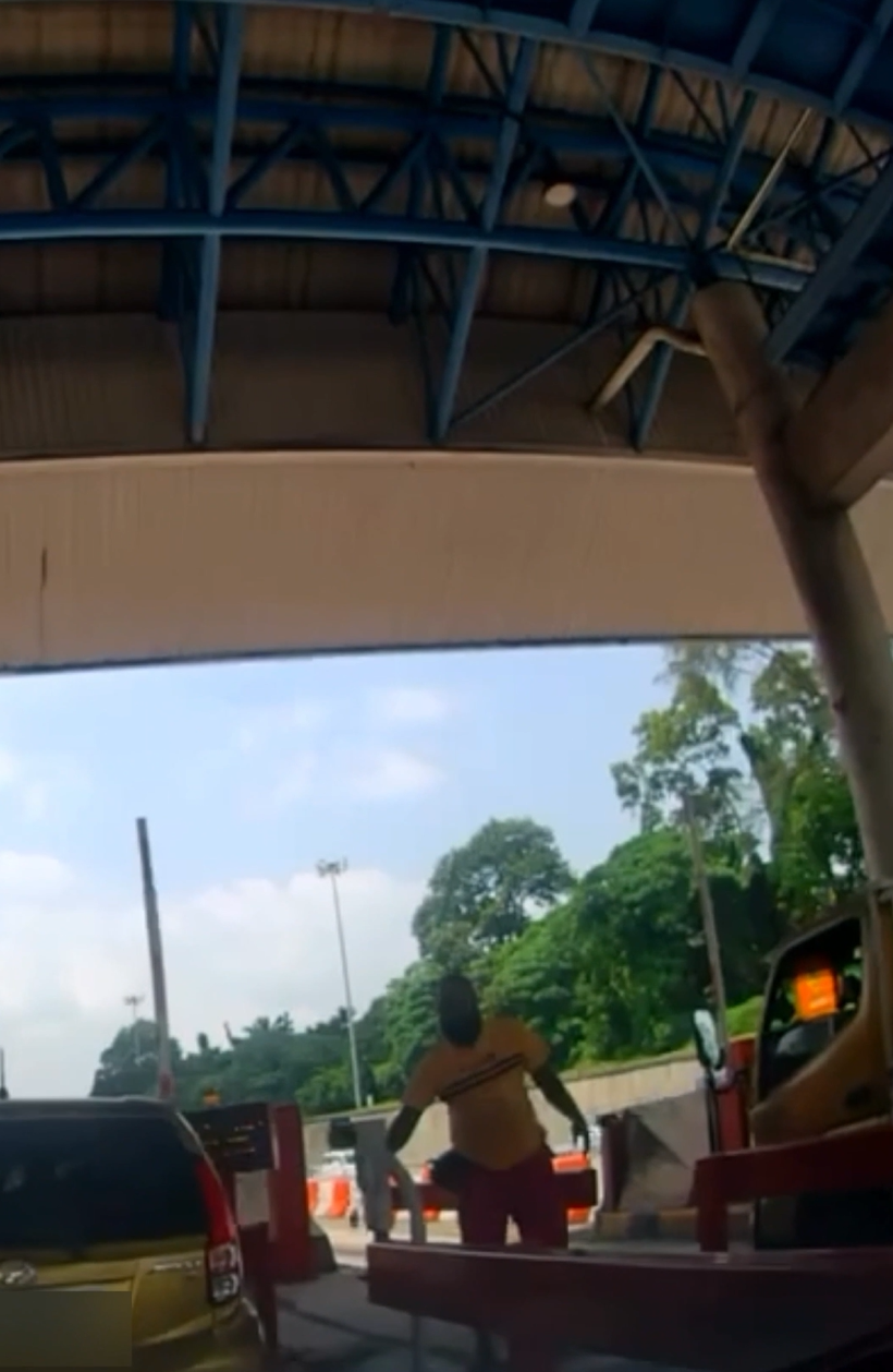msian man helping woman at toll