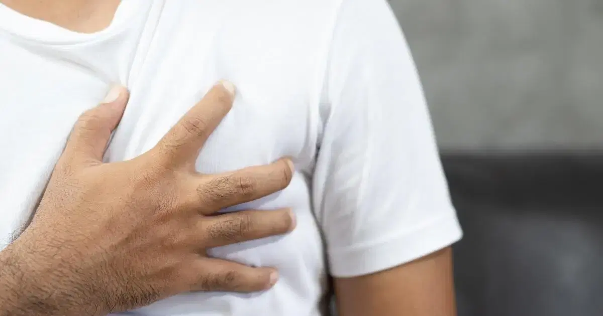 man holding his chest