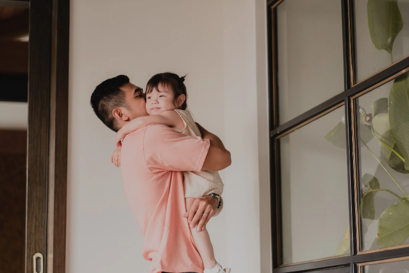 Man hugging his daughter