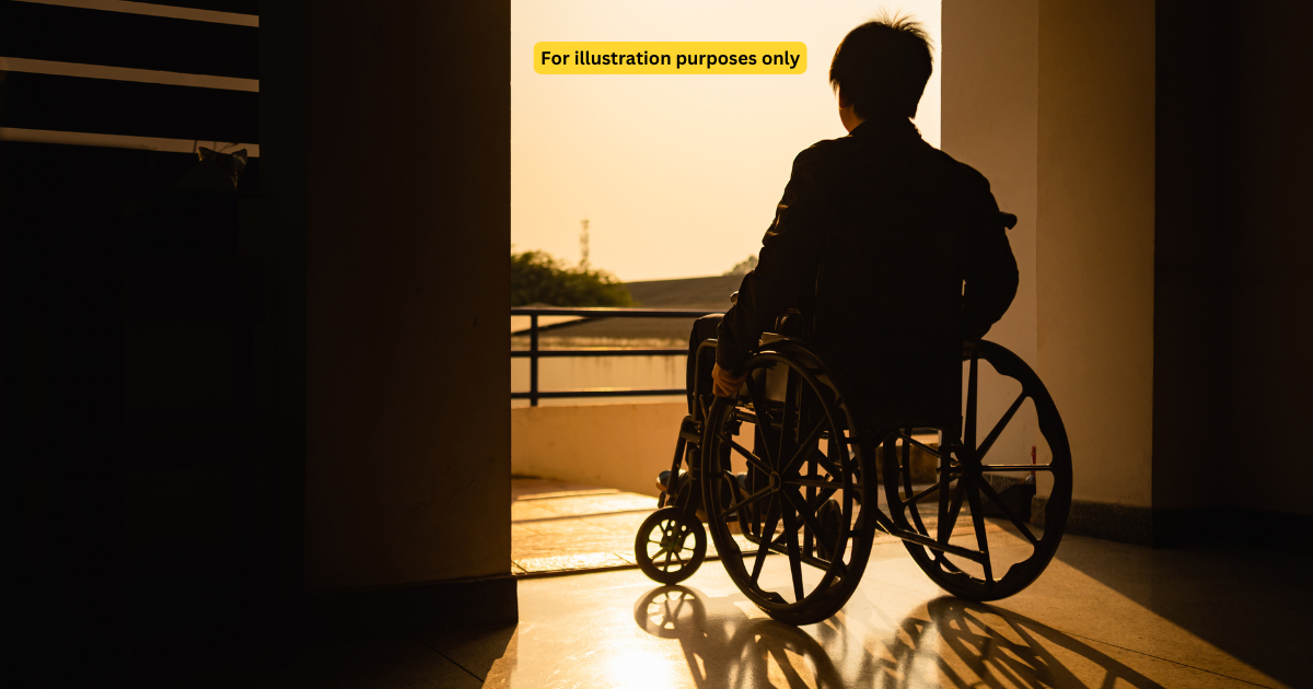 man in wheelchair in the evening