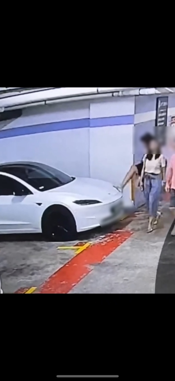 M'sian's tesla gets kicked, spat on by man kicks at kl mall parking lot | weirdkaya