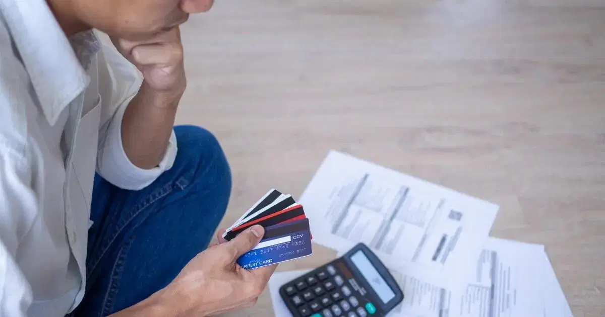 man looking at his bills