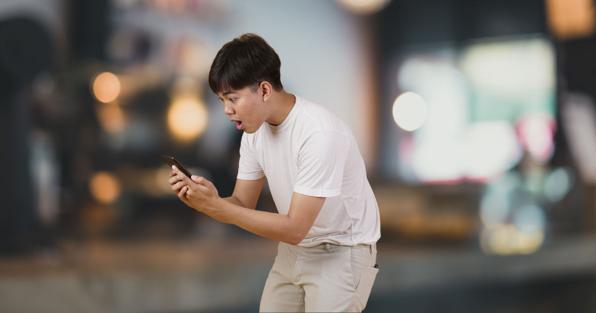 man looking at his phone
