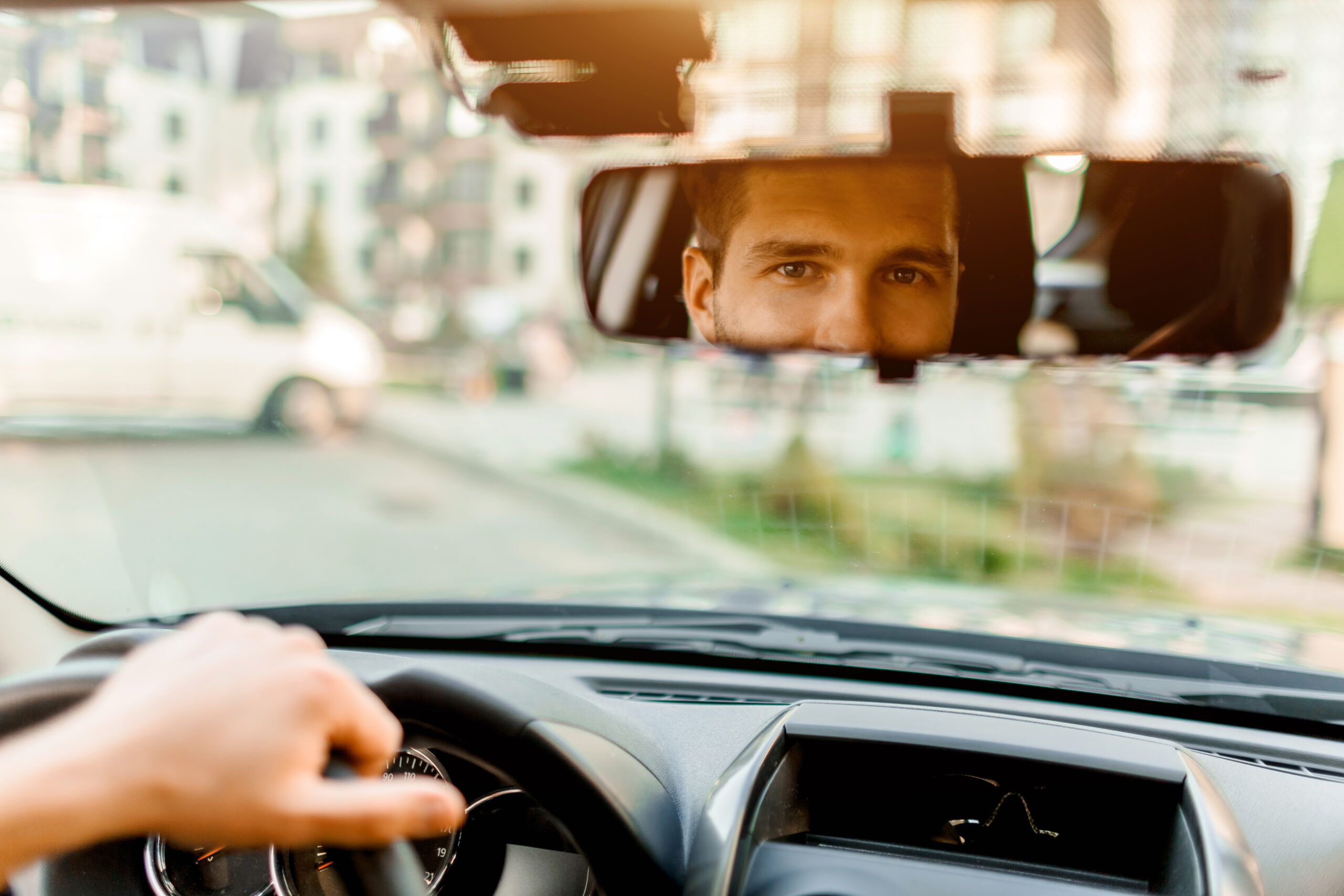 Driver looking through rearview mirror
