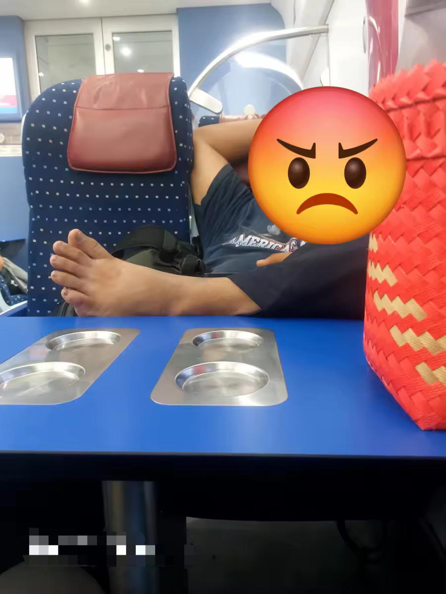 Man places foot on KTM table (2)