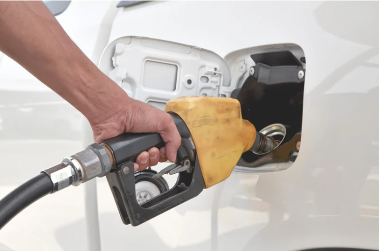 Man pumping petrol into car