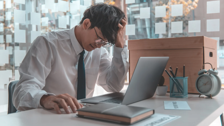 Man sad after getting fired from job