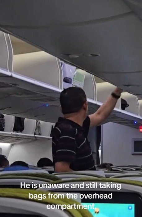 Man searching through luggages suspiciously (2)