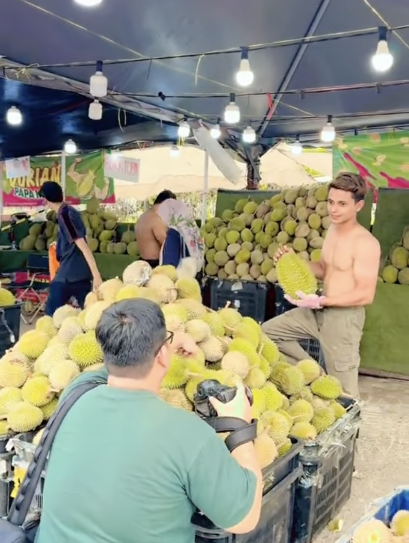 Viral shirtless durian seller apologises, says they took off shirts as weather was too hot  | weirdkaya