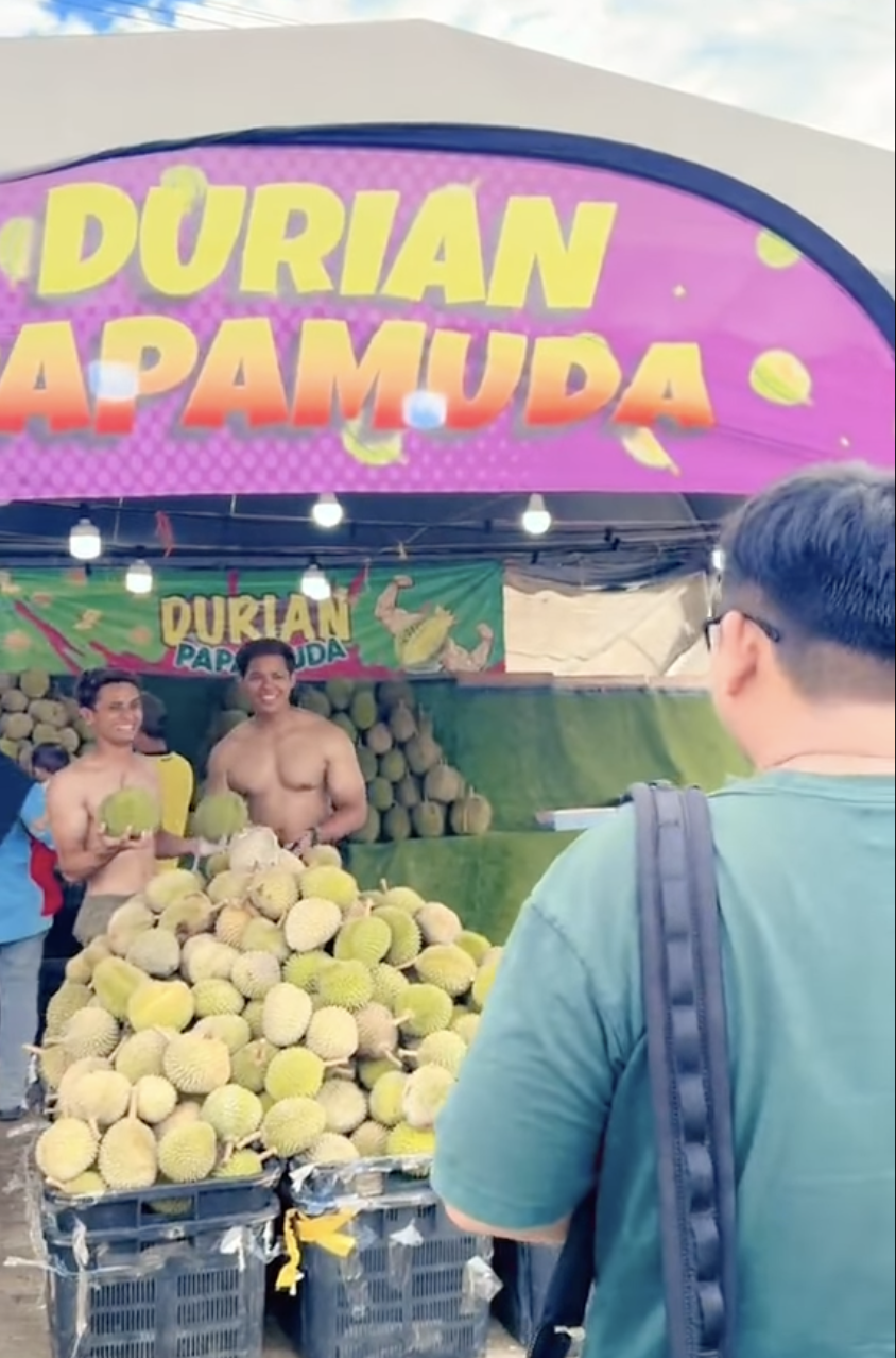 Man selling durian shirtless 2