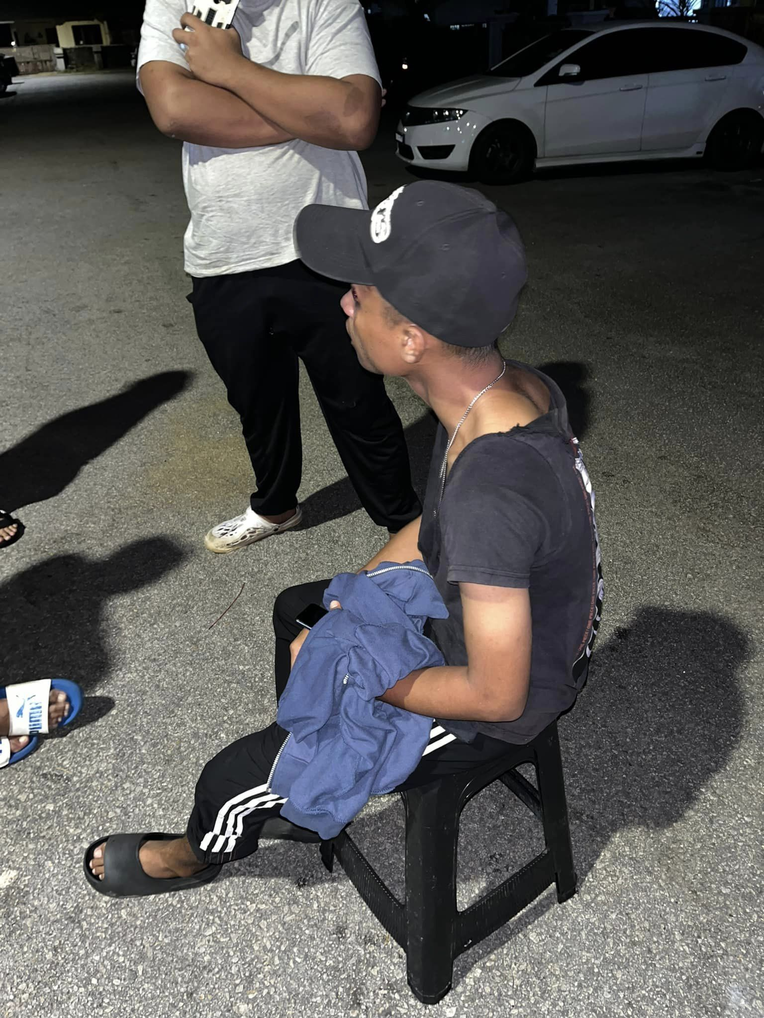 M'sian man sits on a chair after he was assaulted over rm9 burger order