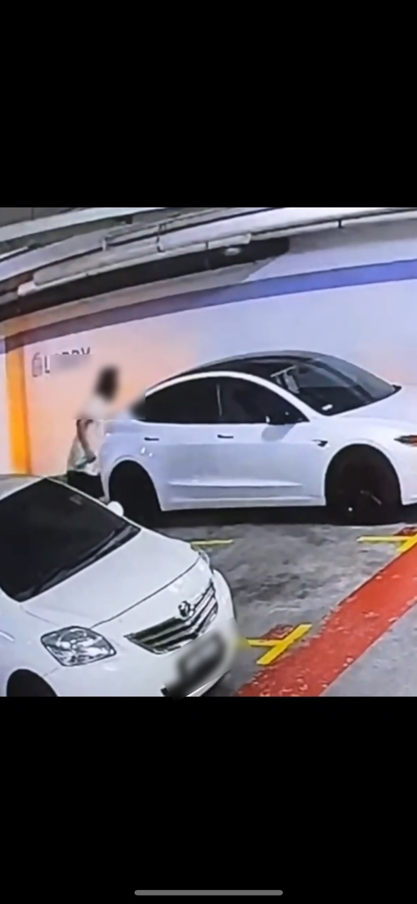 M'sian's tesla gets kicked, spat on by man kicks at kl mall parking lot | weirdkaya