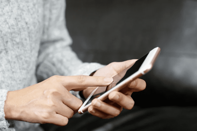 Man touching phone screen