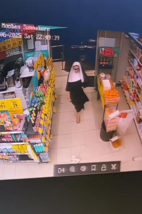 man walking into store wearing nun costume