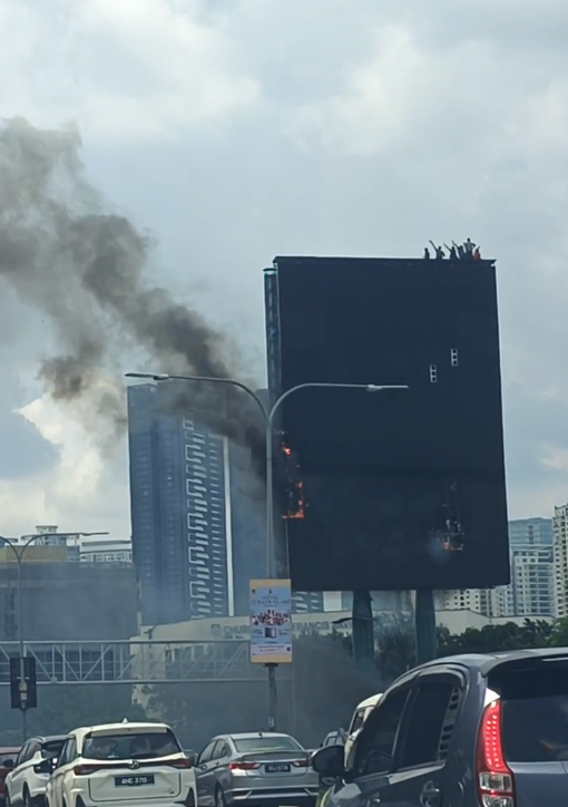 Man waving on the billboard