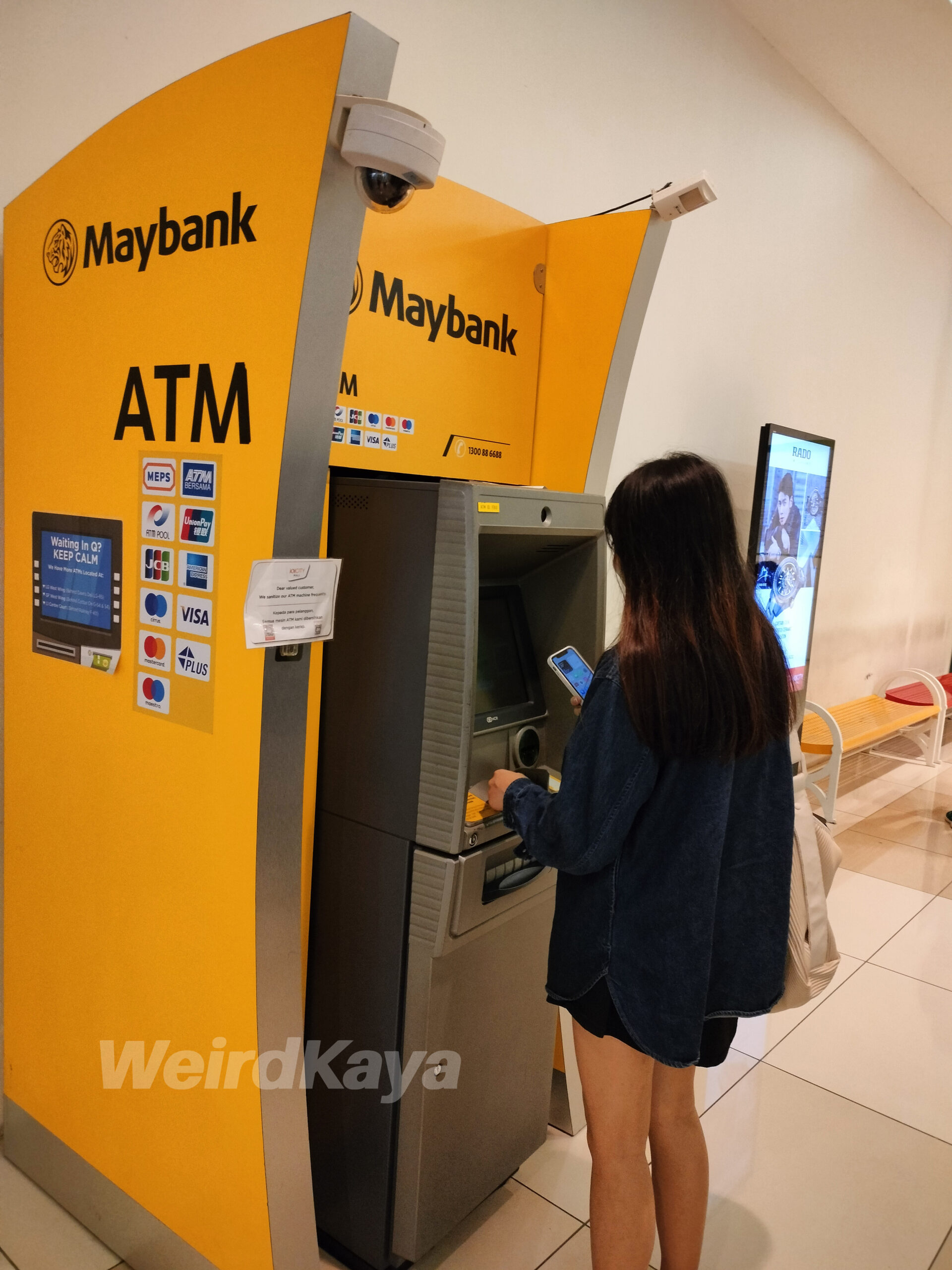 Maybank atm woman using  atm