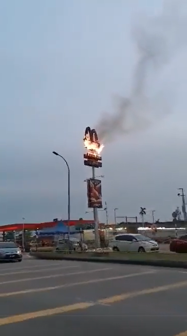 Burning mcdonald's signboard in johor