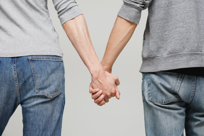 Men holding hands