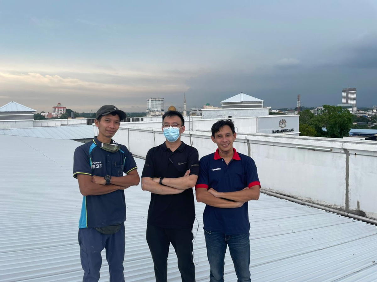 Danny with his workers