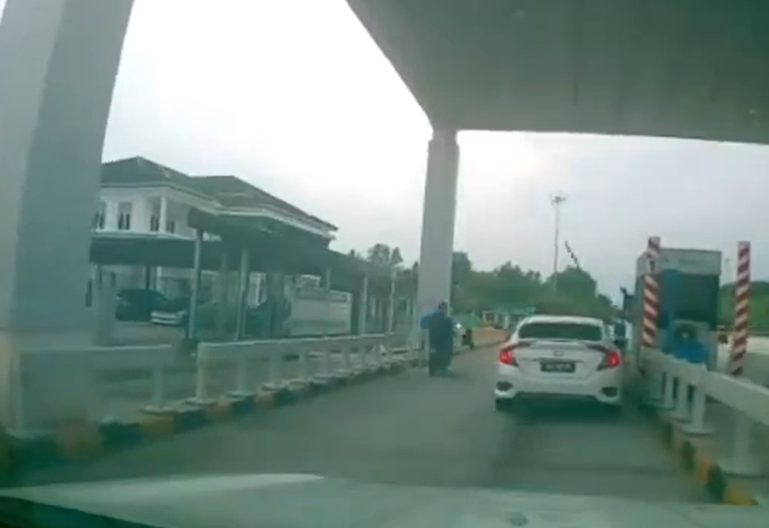 Motor trying to zip through toll