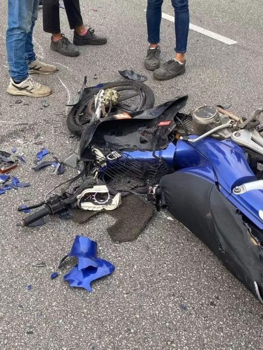 Damaged motorcycle of m'sian dad who died saving his daughter
