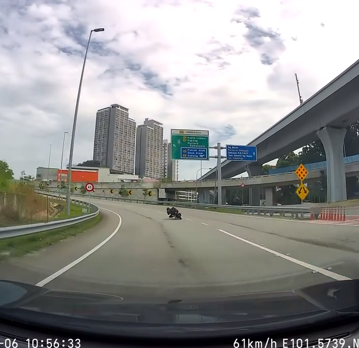 Motorcyclist doing dangerous stunt on road