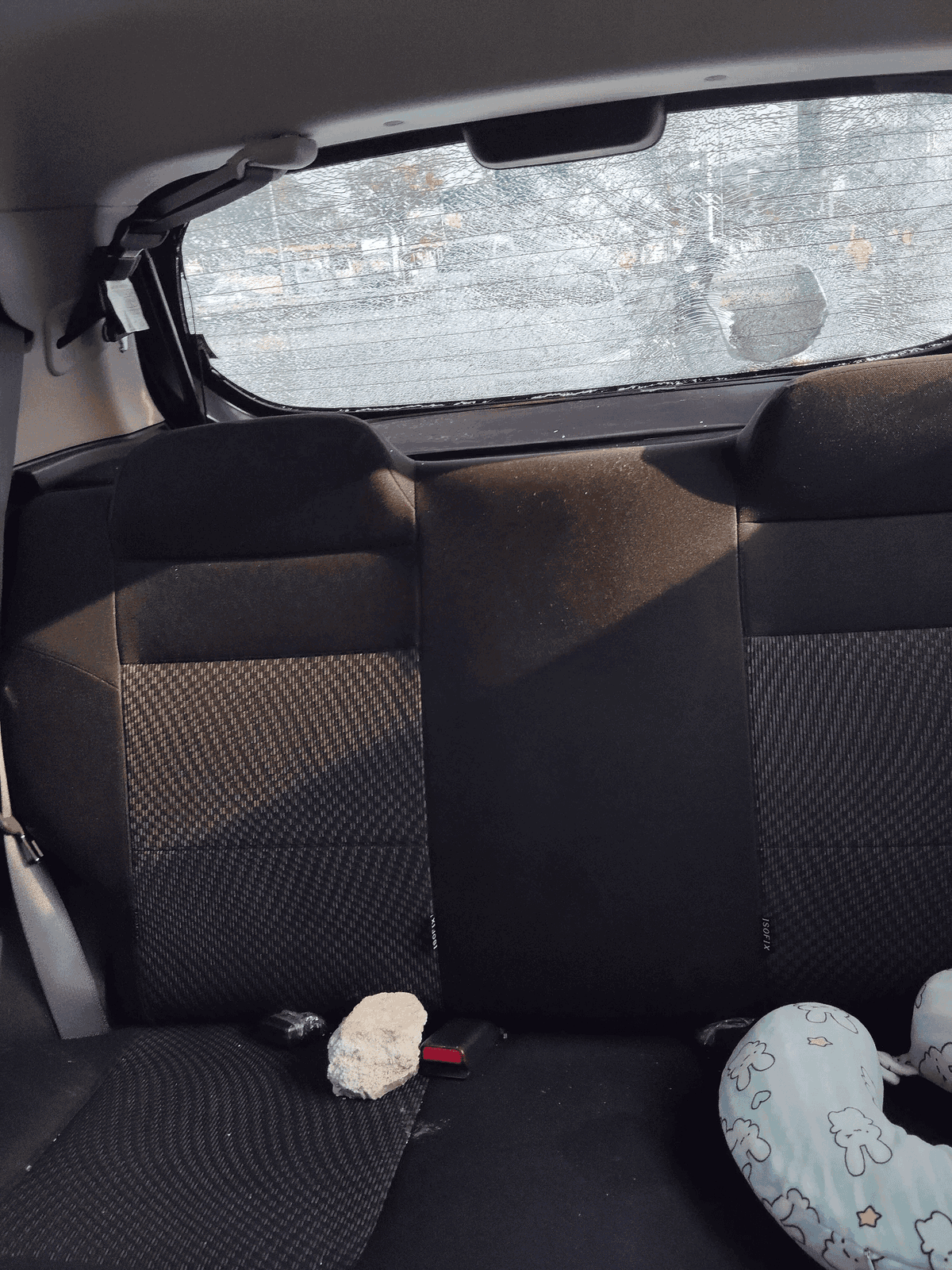 Motorcyclist throws rock at car 2