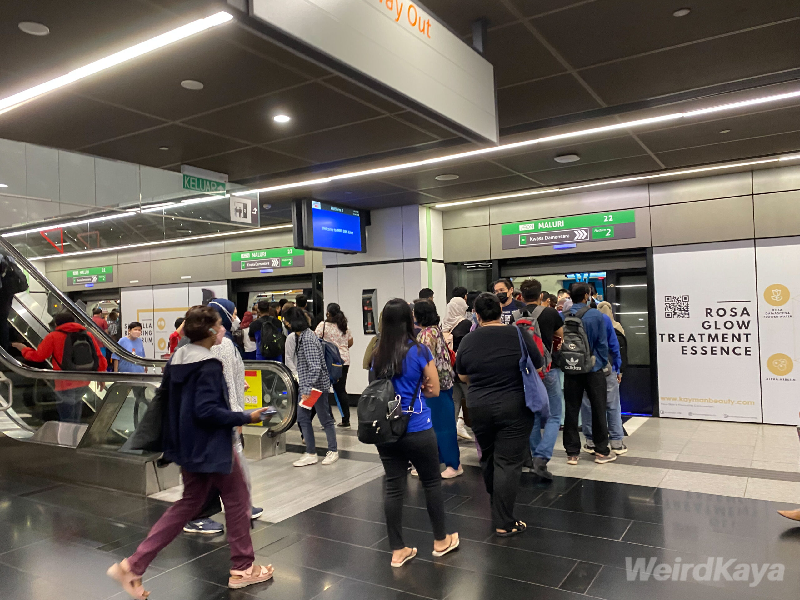 People lining up at mrt station