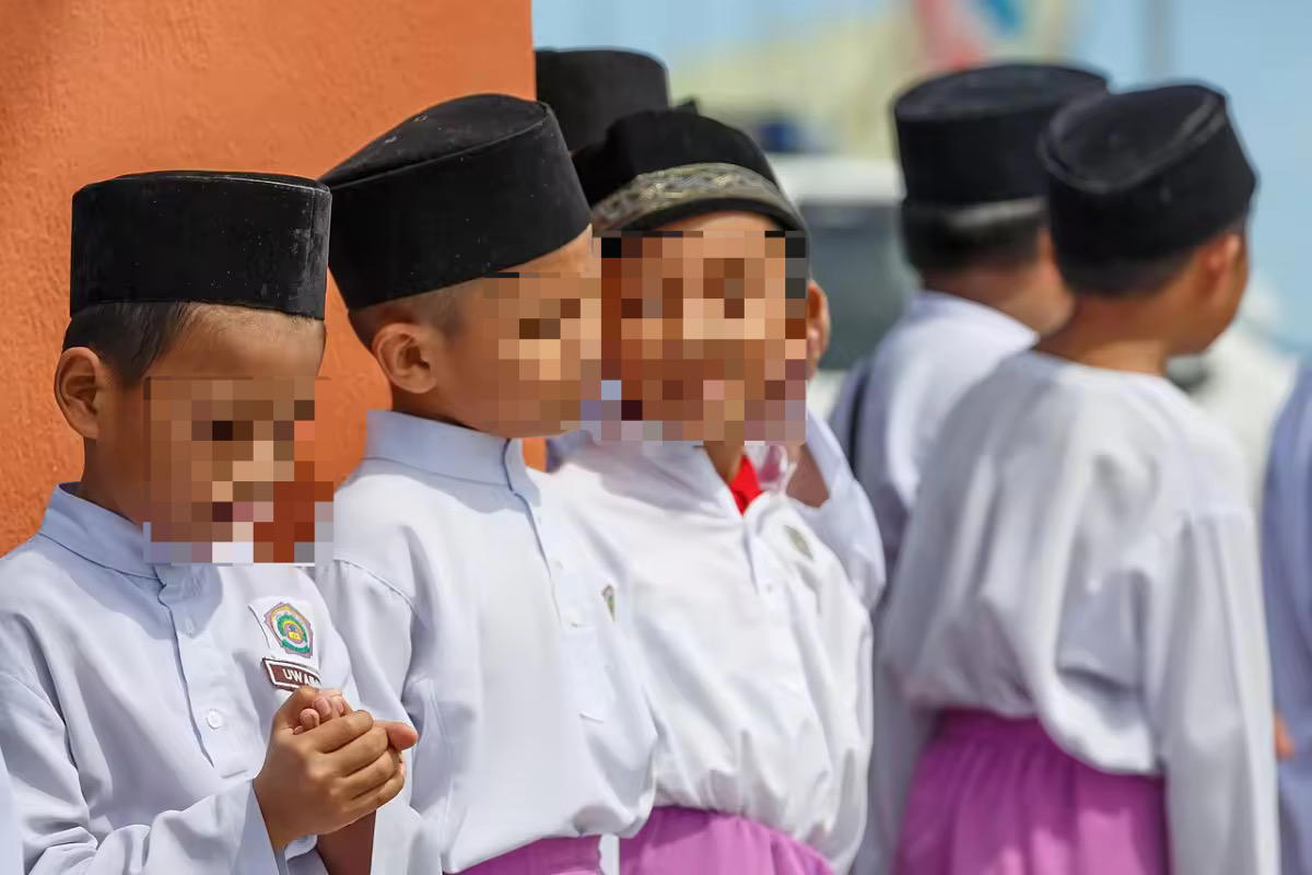 M'sian boys wearing songkok at school