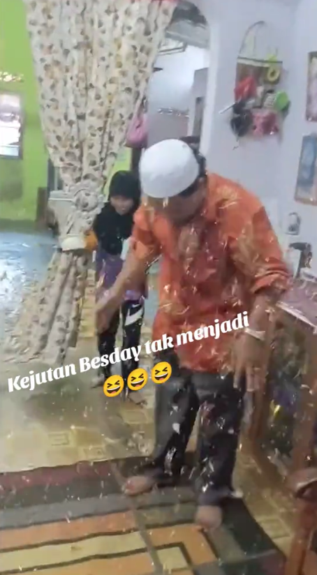 msian family celebrating father's birthday