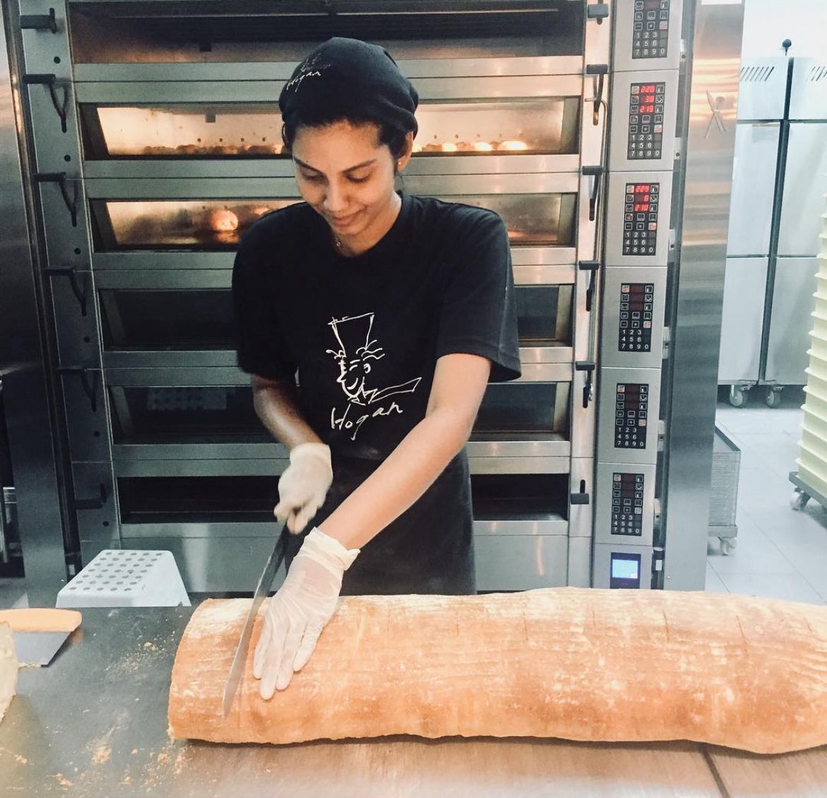 Msian girl cutting bread