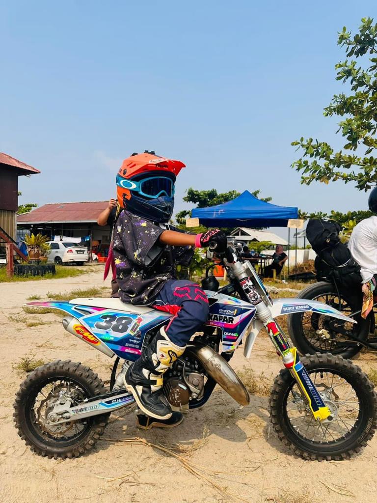 Msian girl with her motorcross at her training session