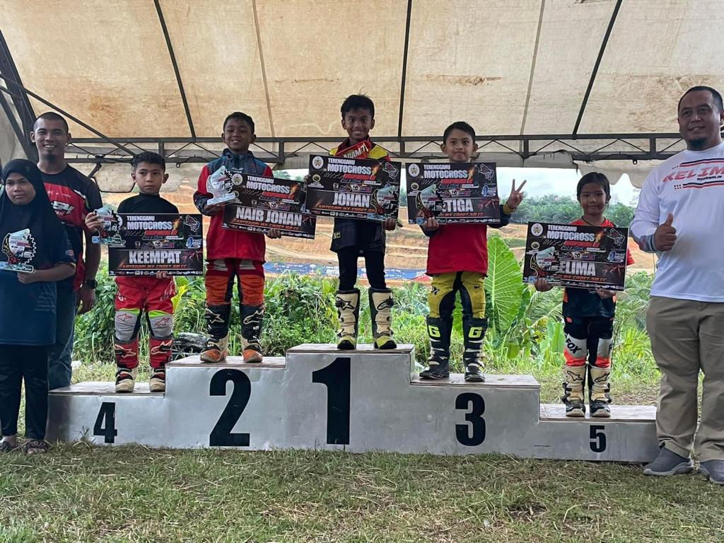 Msian kids at the award giving ceremony for motorcross competition.