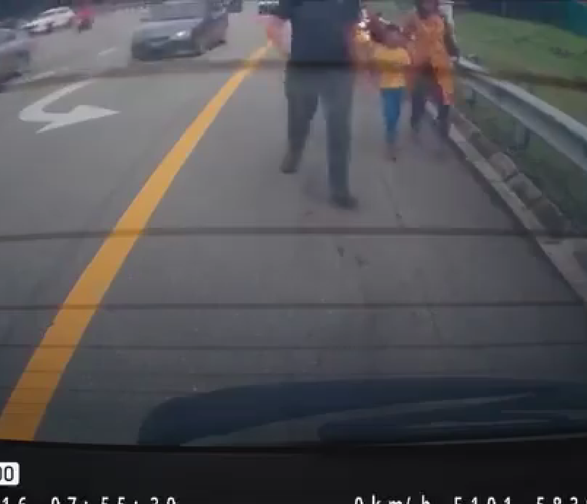 Msian man bringing the wife and kid to his car for a ride