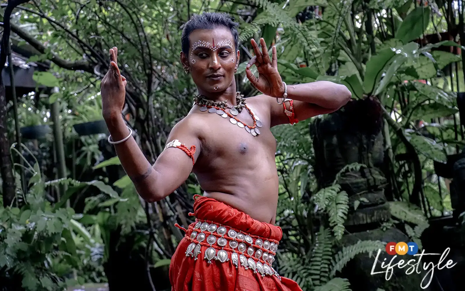 Msian man doing odissi pose