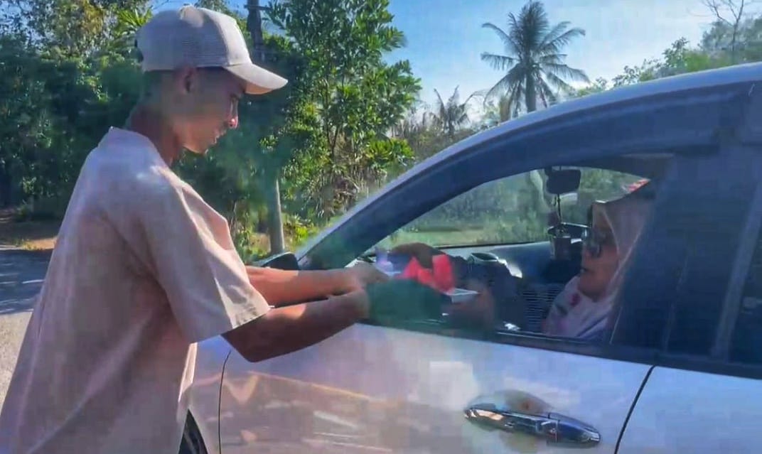 msian man giving watermelon