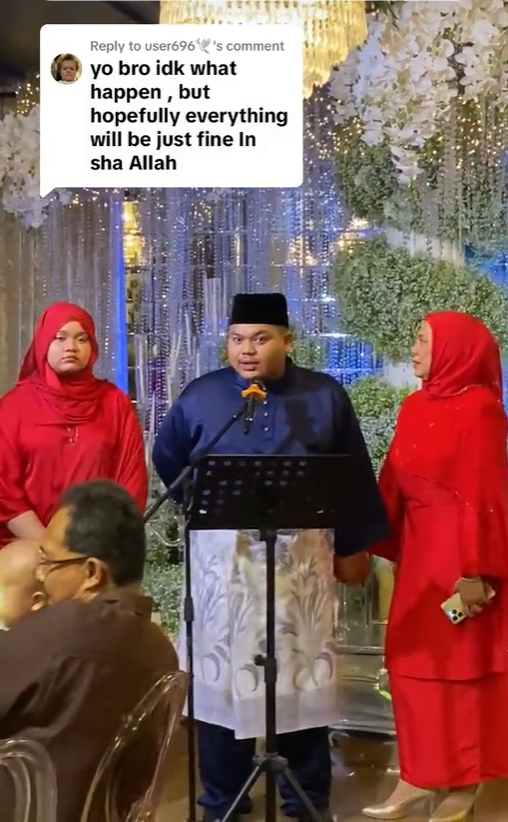 M'sian man speaking to guest at wedding reception