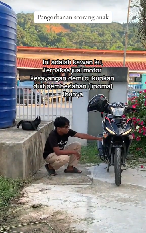 M'sian rider naazrie ali saying goodbye to his motorbike