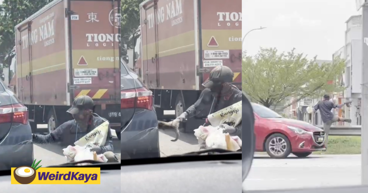 M'sian Roadside Vendor Saves Cat Trapped Under Car Wheel In JB, Touches Netizens