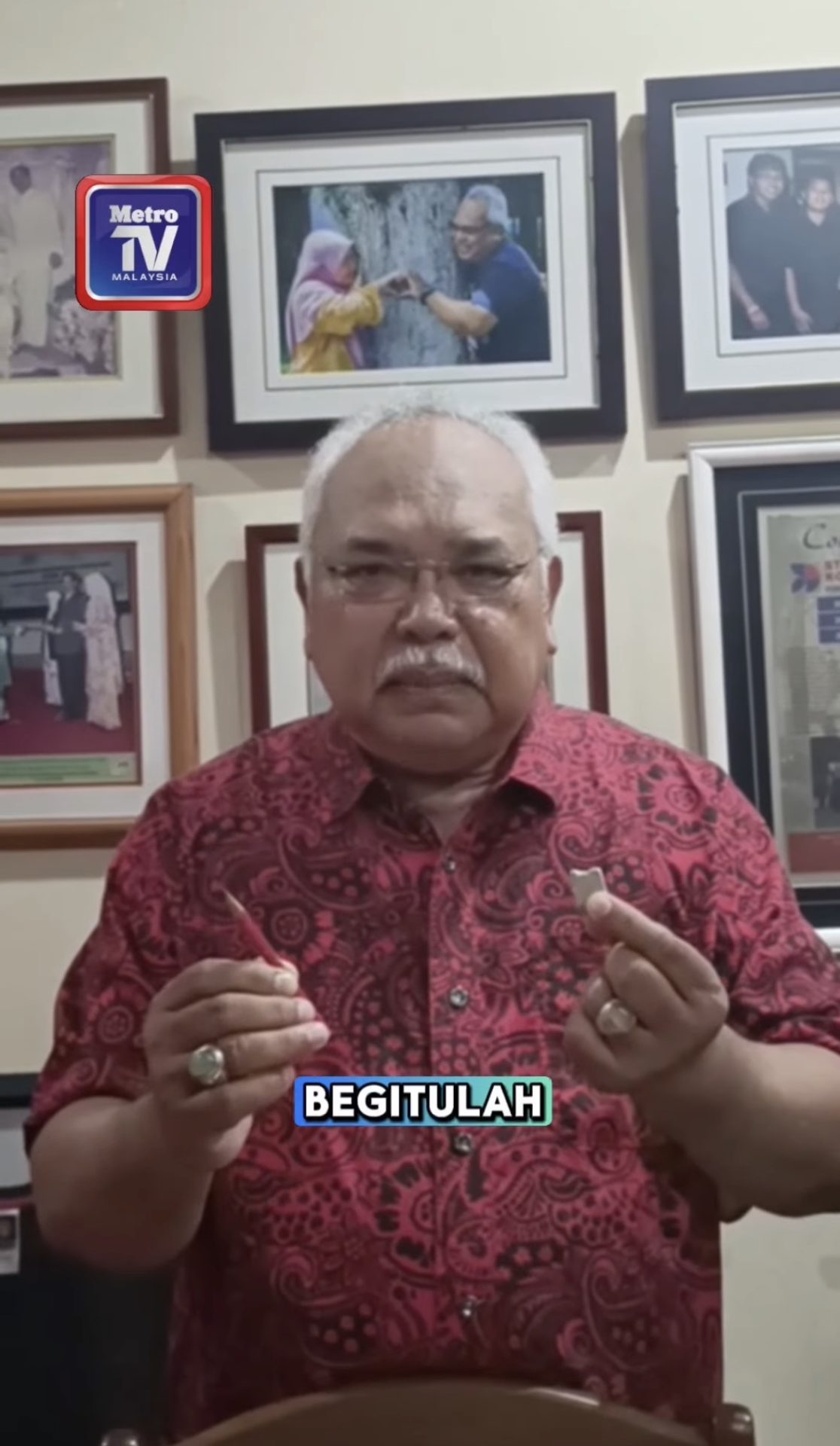 msian teacher showing his teacher's day gift