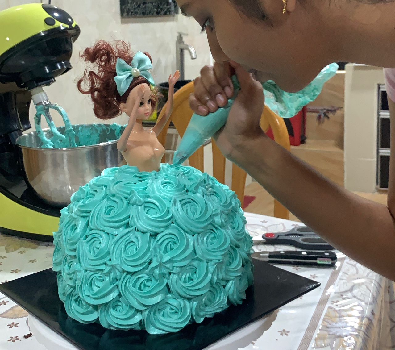 Msian woman decorating cake