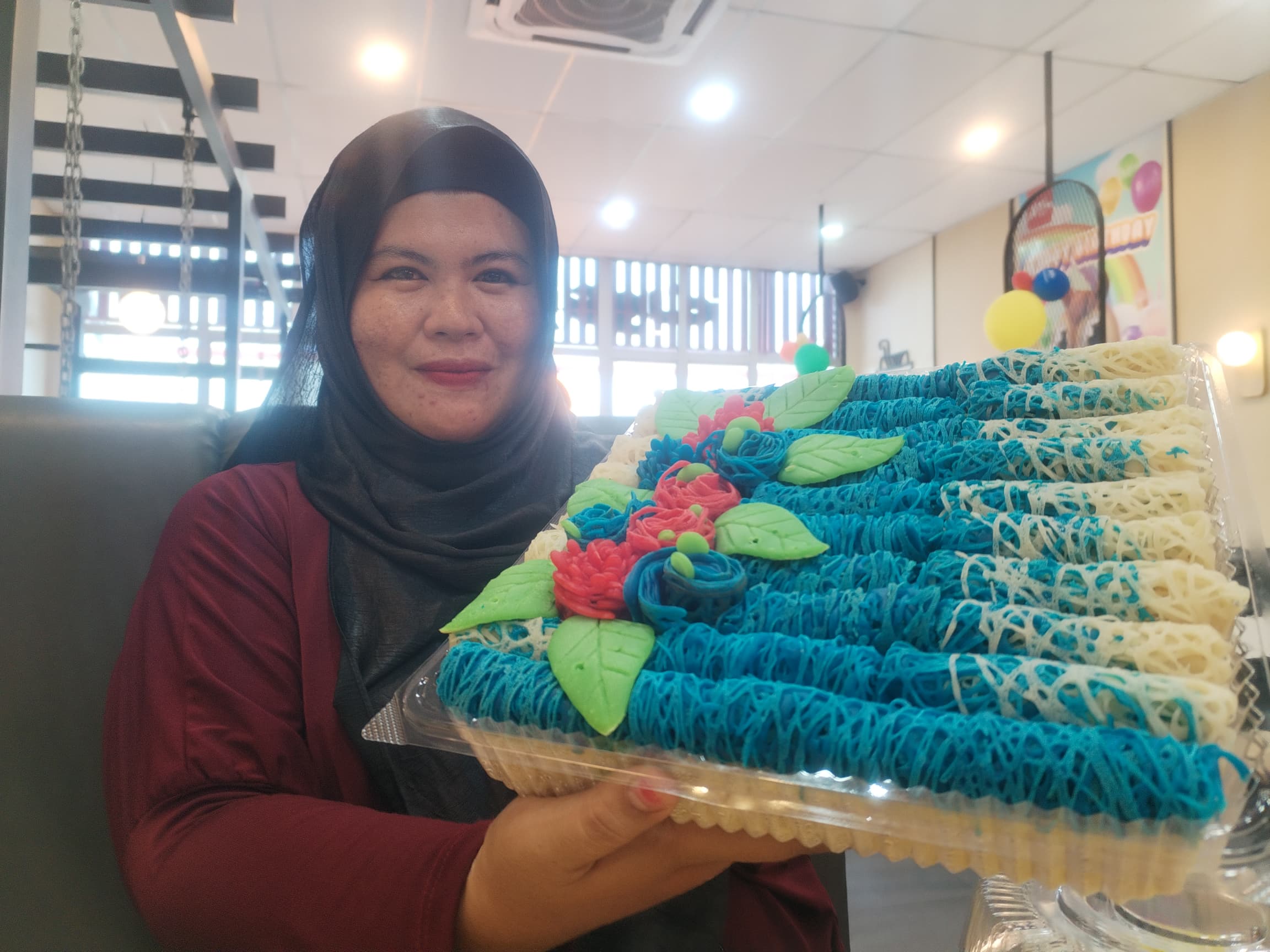 Msian woman showing her roti jala