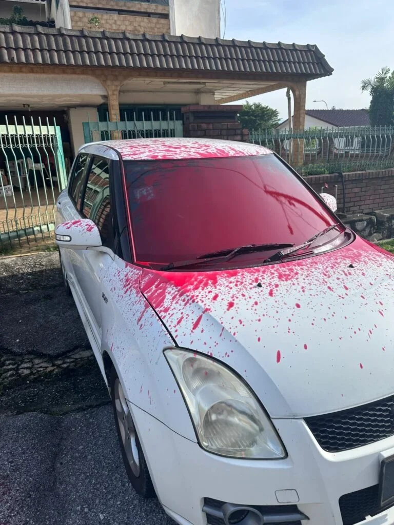 M'sian woman's suzuki car splashed with red paint