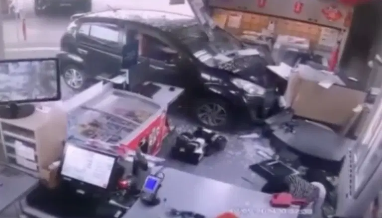 Myvi crashes into convenience store at ipoh petrol station