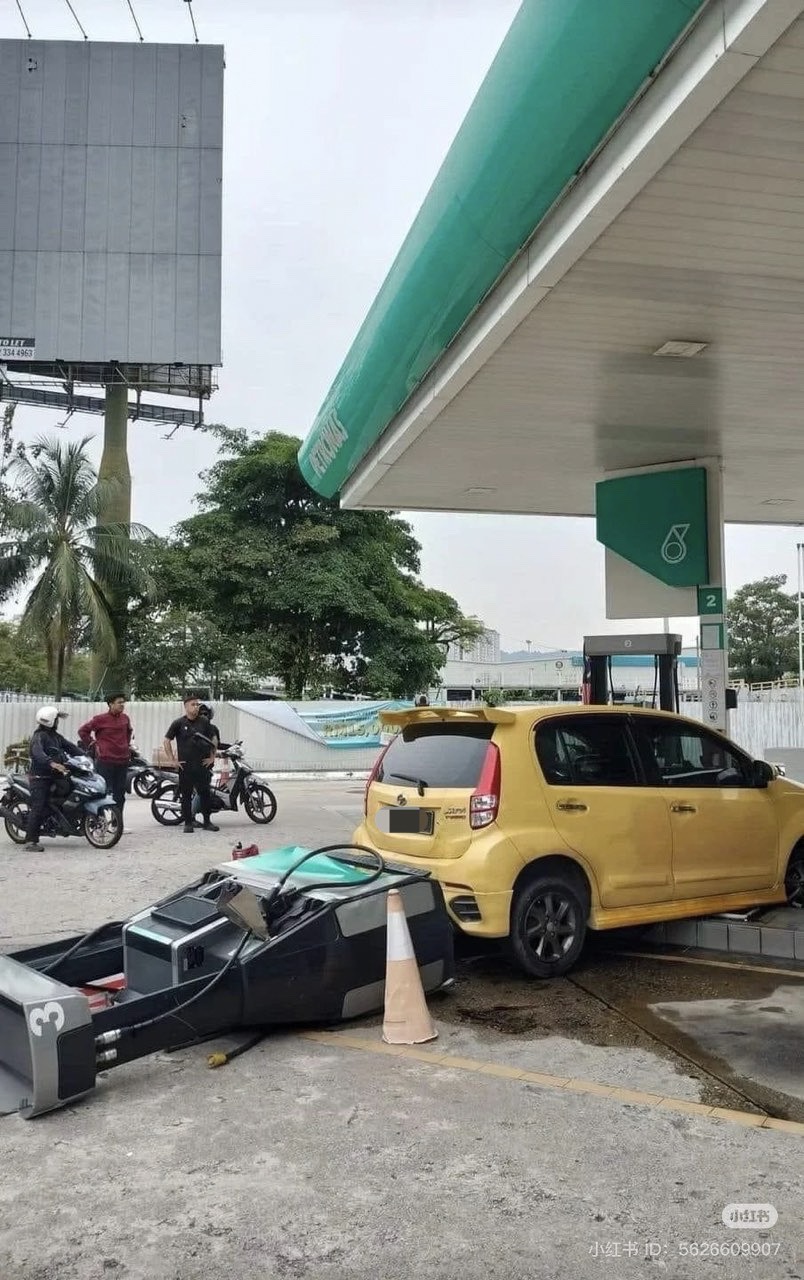 Myvi knocks petrol pump over