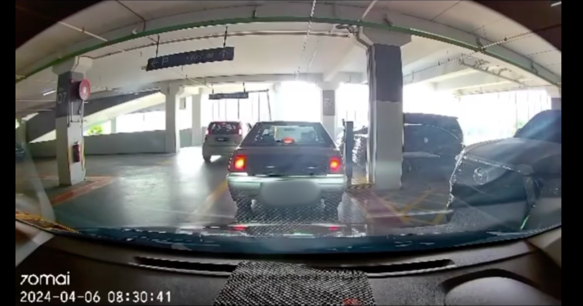 Myvi skips out on parking fee by zooming past boom gate while another driver was paying