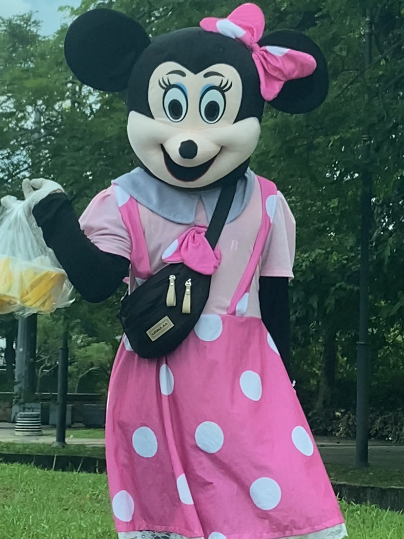 Netizen stumped by scary minnie mouse mascot selling pickled fruits by the roadside